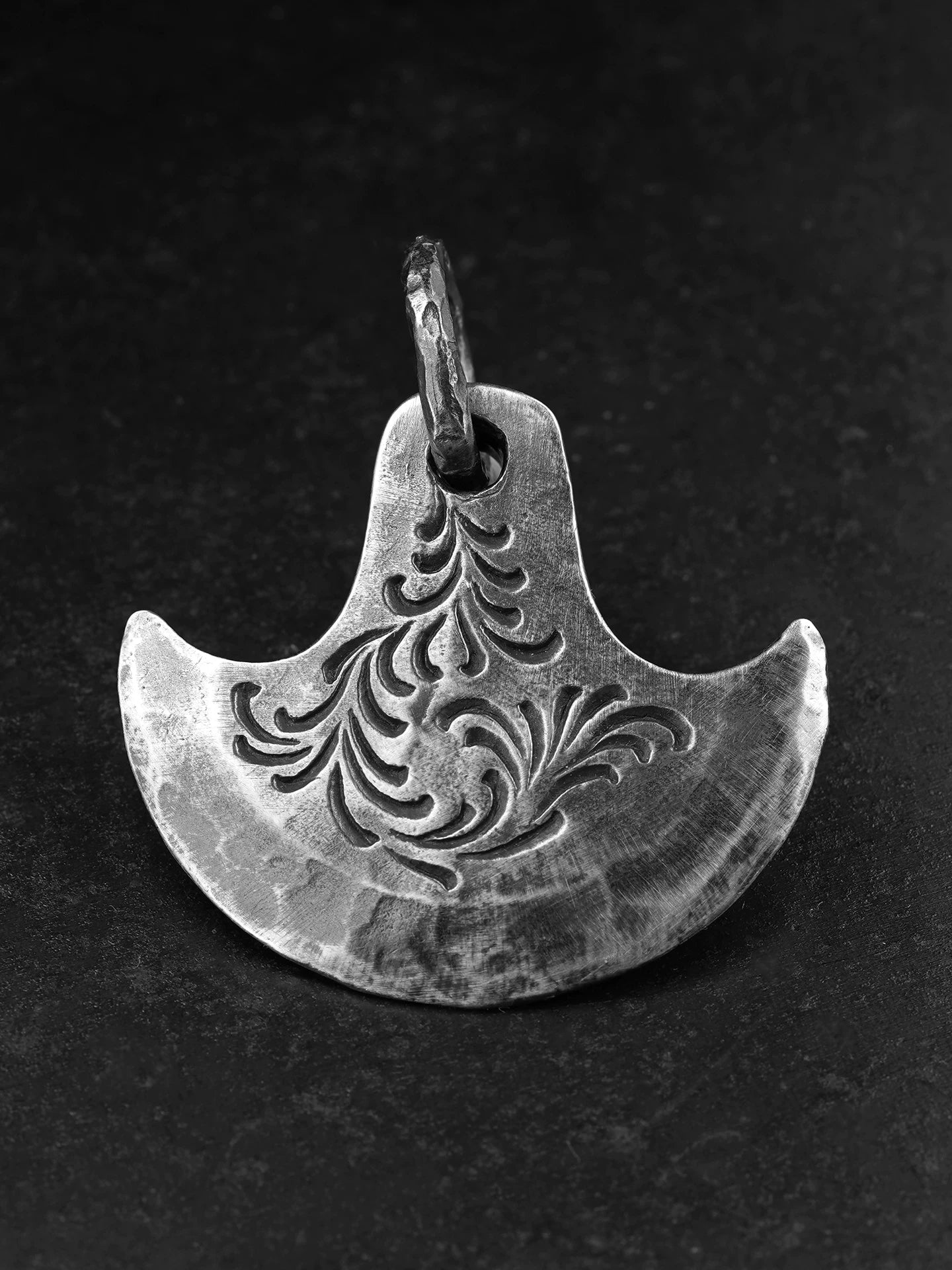Front view of hand engraved axe sterling silver pendant