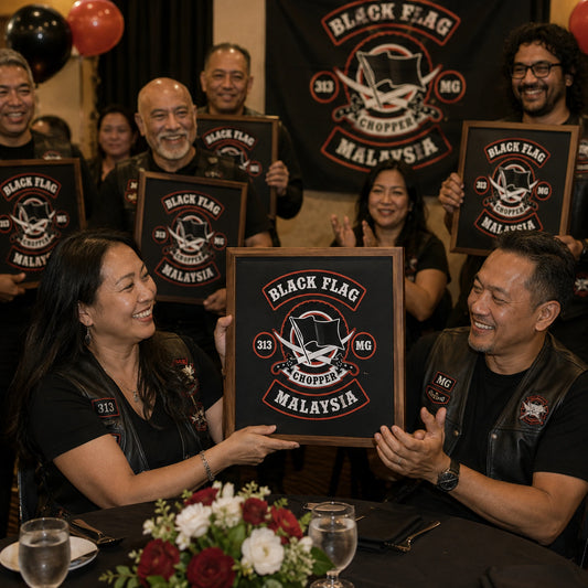 Matching motorcycle club anniversary plaques at a chapter celebration.