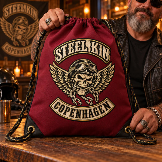 A motorcycle club president presents a limited-edition anniversary drawstring bag at a clubhouse celebration.
