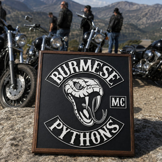 Annual club ride commemorative plaque beside parked V-twin motorcycles.