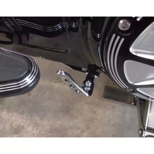 Chrome Fangster kickstand extension mounted on a Harley motorcycle