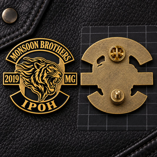 Monsoon Brothers motorcycle club badge shown with a pin clutch and screw post arranged as a dual-point fixing system.