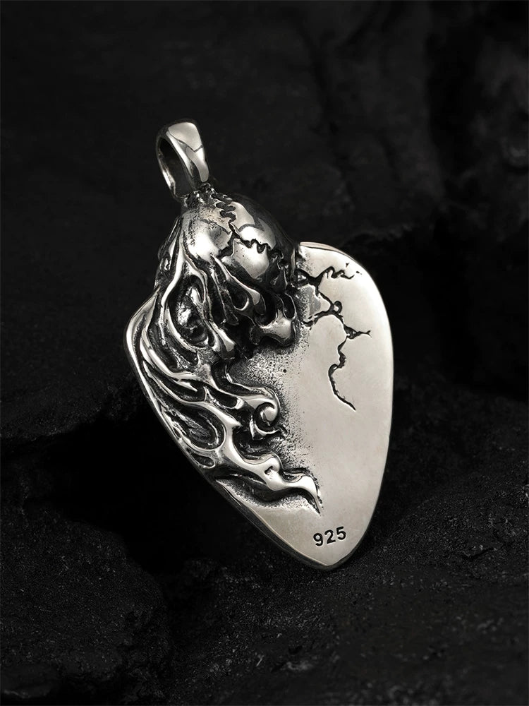 Back and side view of the 925 sterling silver flaming skull guitar pick pendant