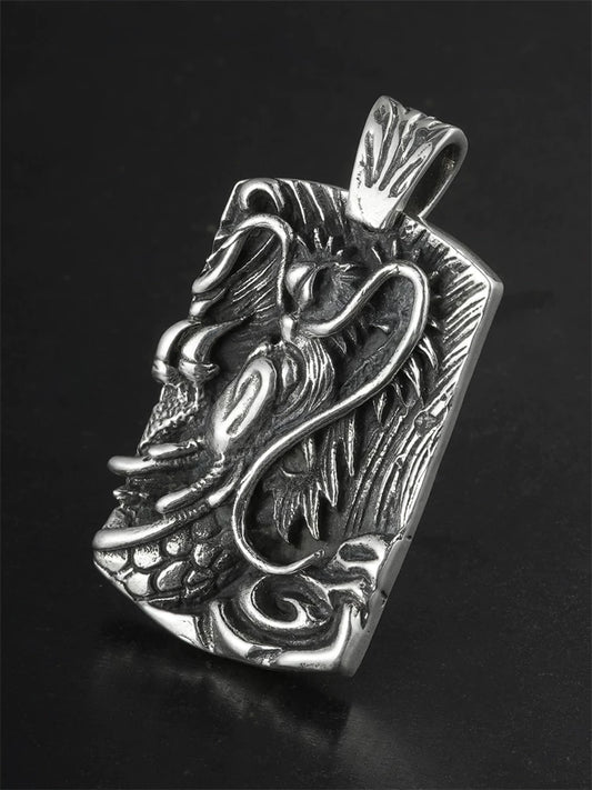 Flying dragon relief sterling silver biker pendant angled view