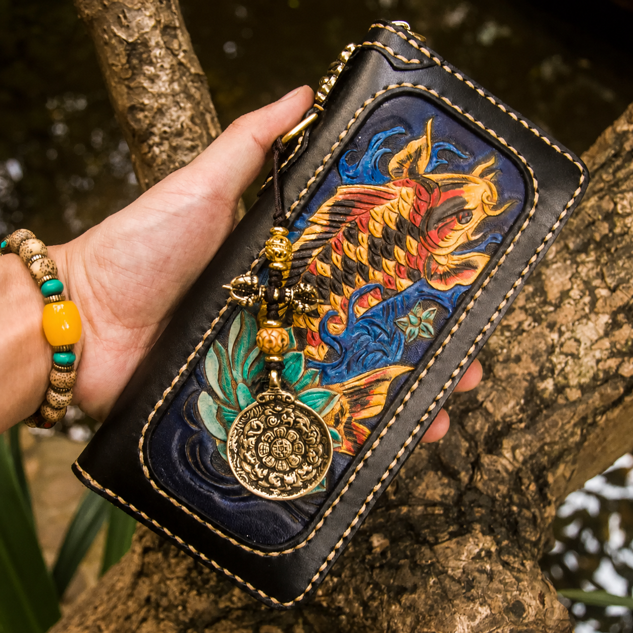 Fortune koi leather long wallet held in hand