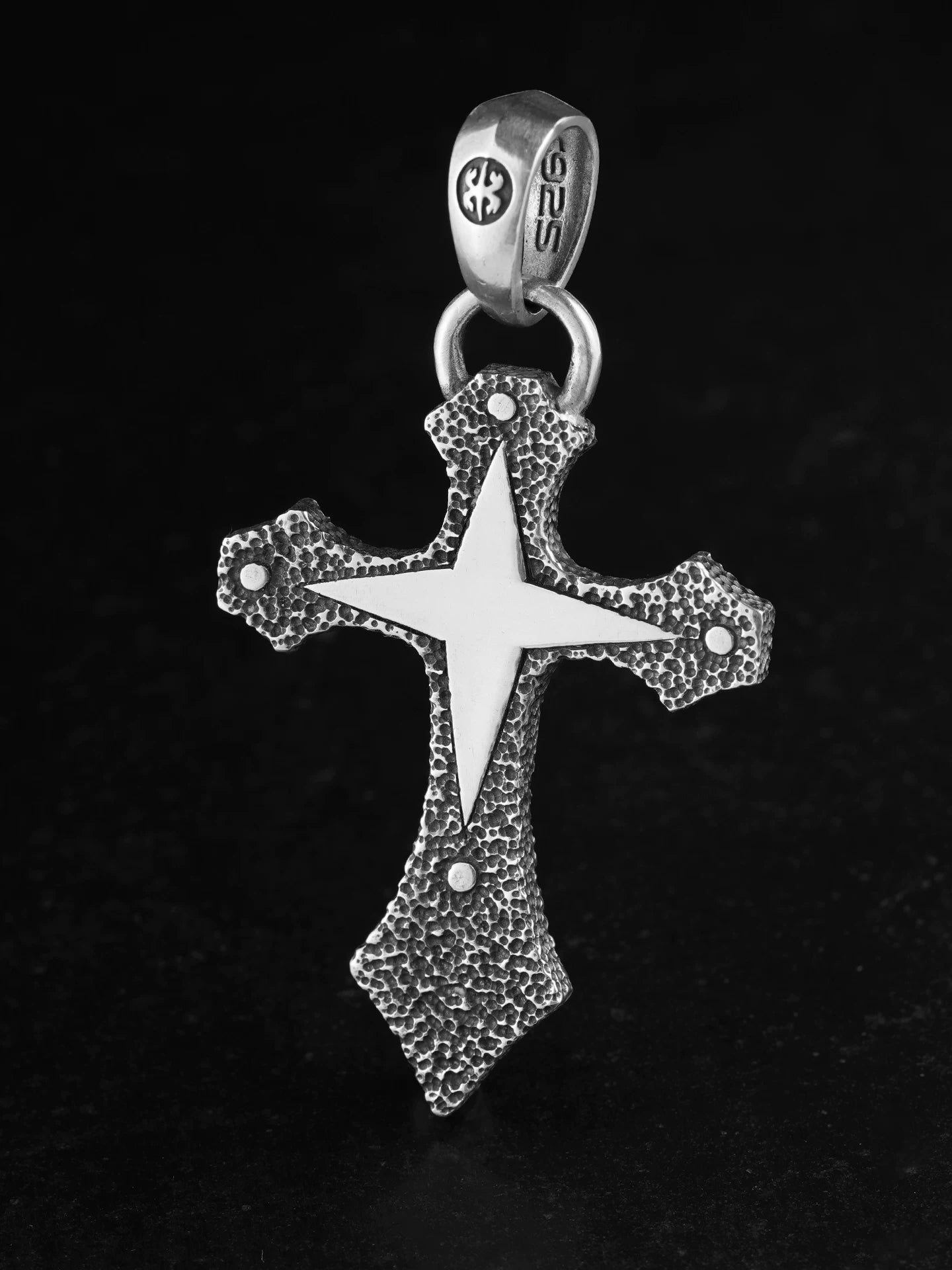 Front view of four-point star cross sterling silver biker pendant