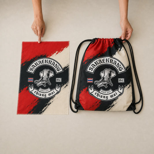 A designer prepares a custom motorcycle club drawstring bag layout from approved artwork.