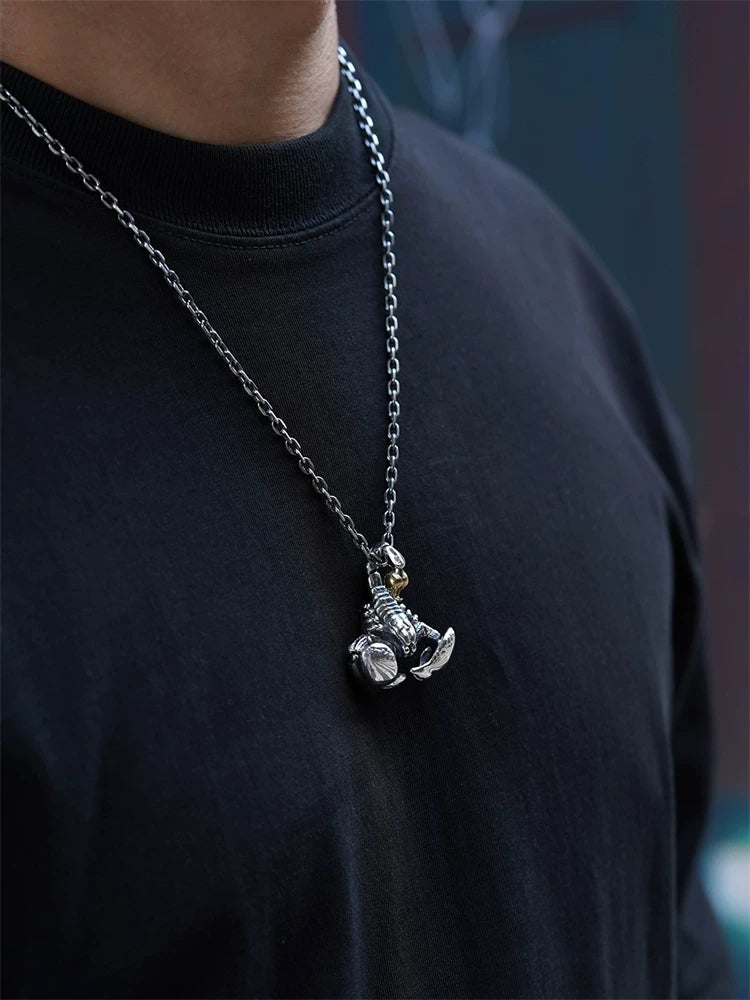 Gold-accent scorpion sterling silver biker pendant worn on chain