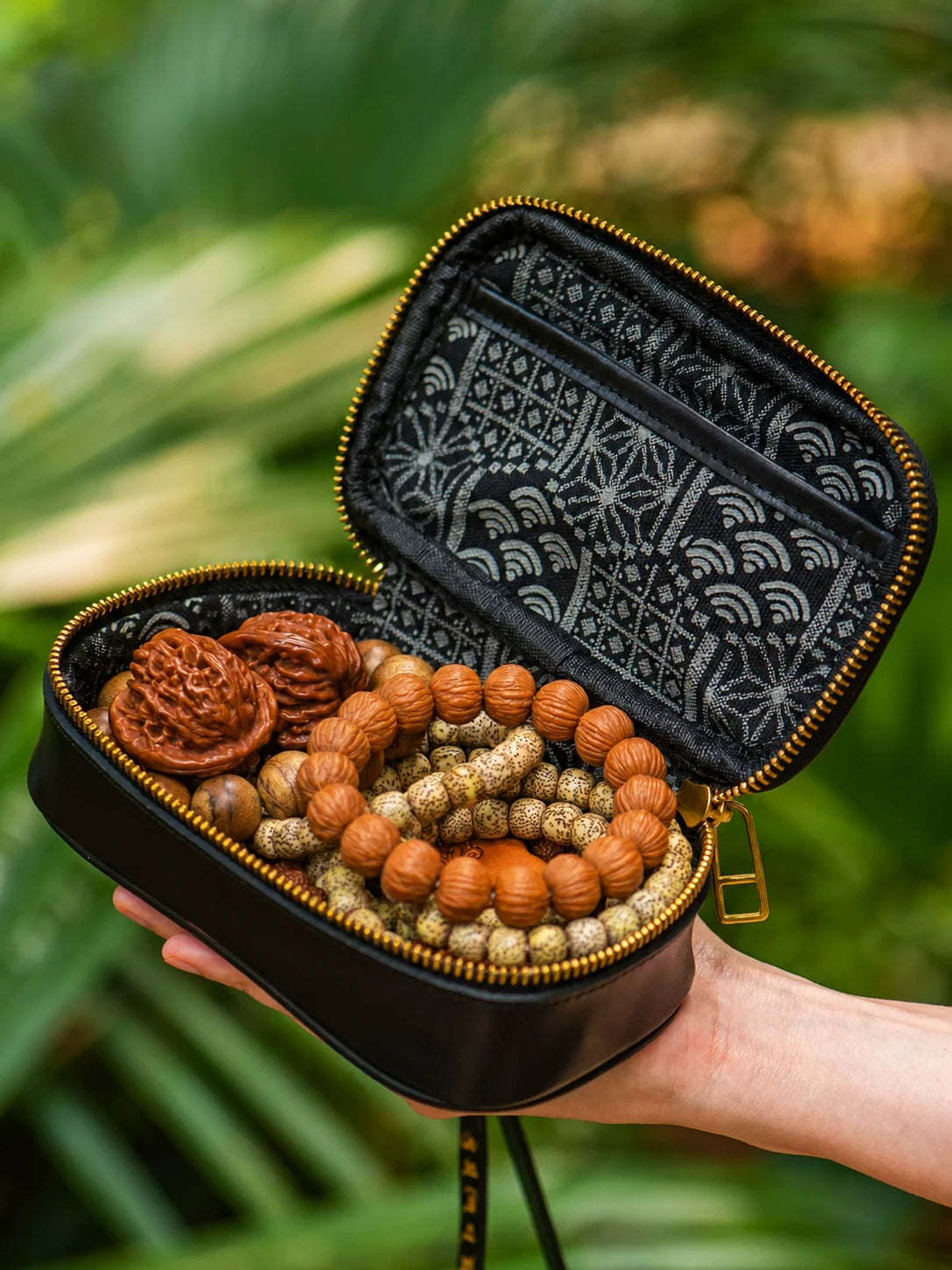 open koi leather organizer with patterned lining and displayed beads