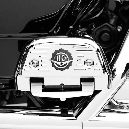 HD medallion passenger footboard backplate cover installed on a Harley motorcycle