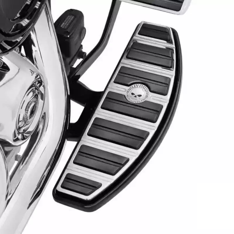 Skull rider footboard pad installed on a Harley Softail motorcycle