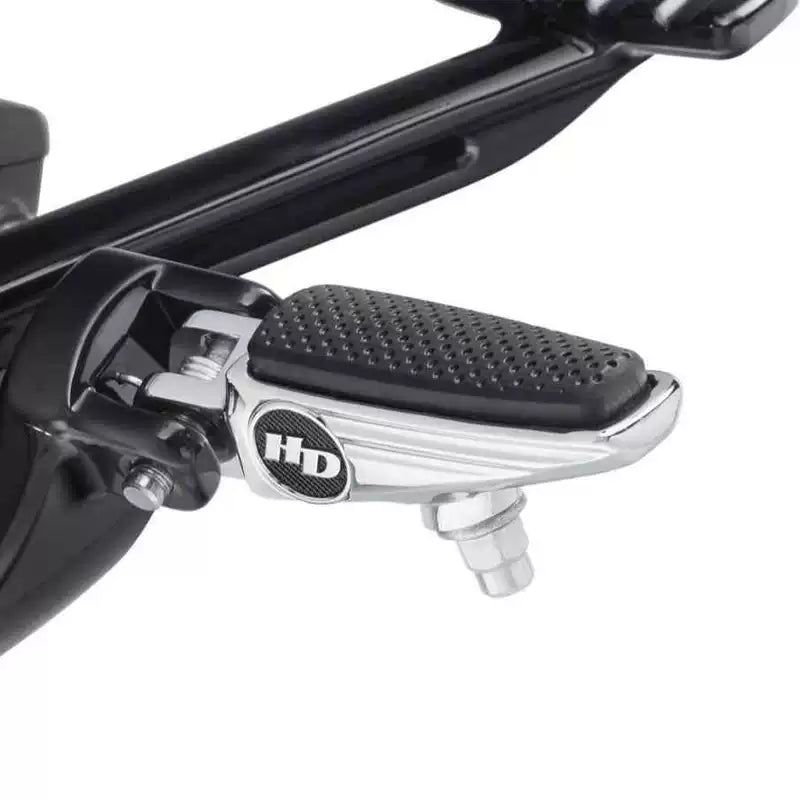 Chrome Fat Bob front foot peg installed on a Harley motorcycle