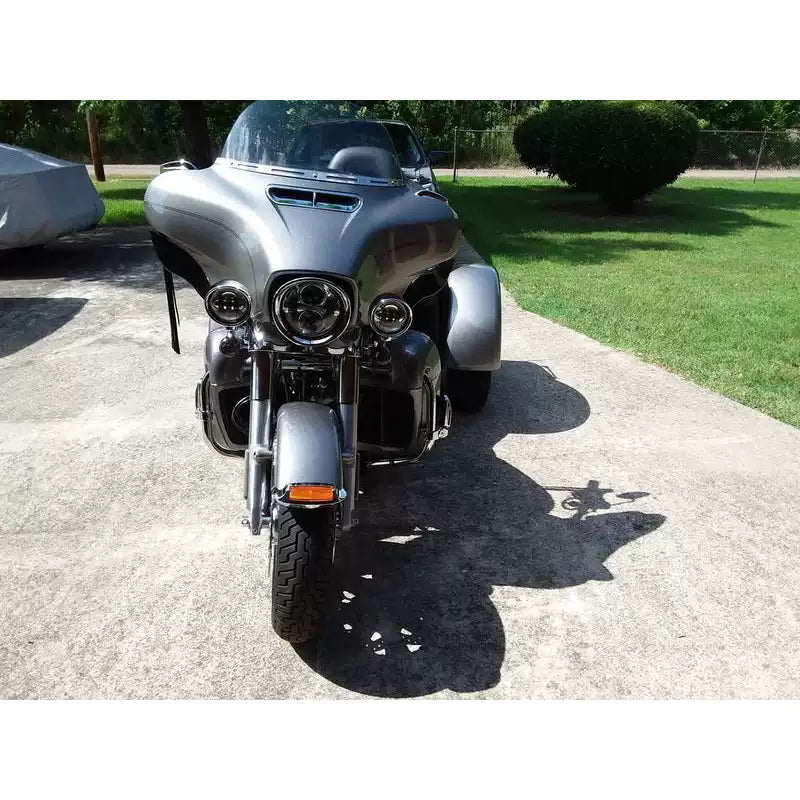 Close-up detail of chrome Harley-Davidson headlight visor