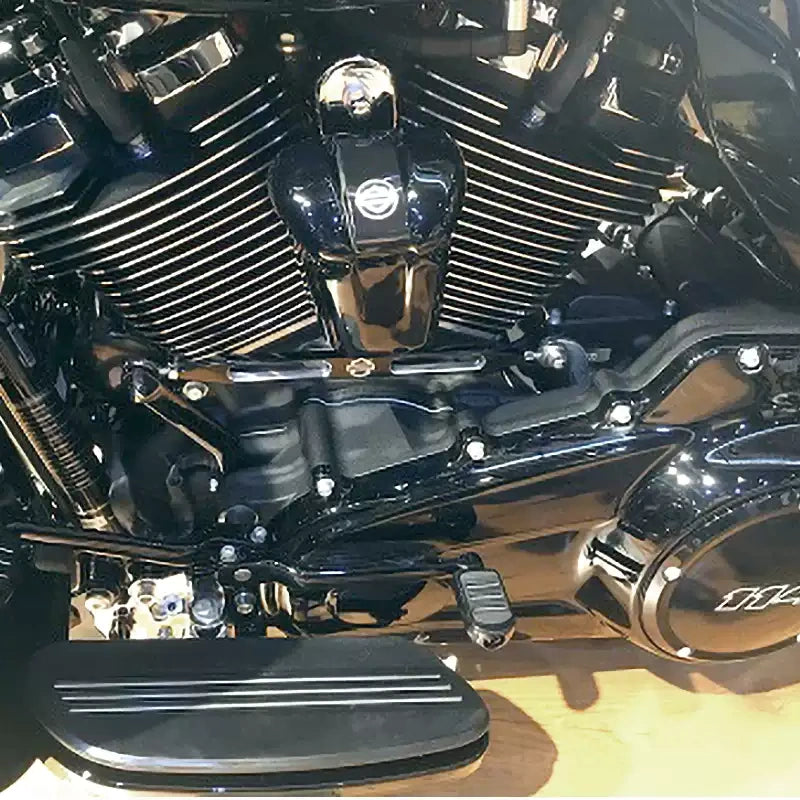 Chrome motorcycle shift linkage shown installed with rider footboard