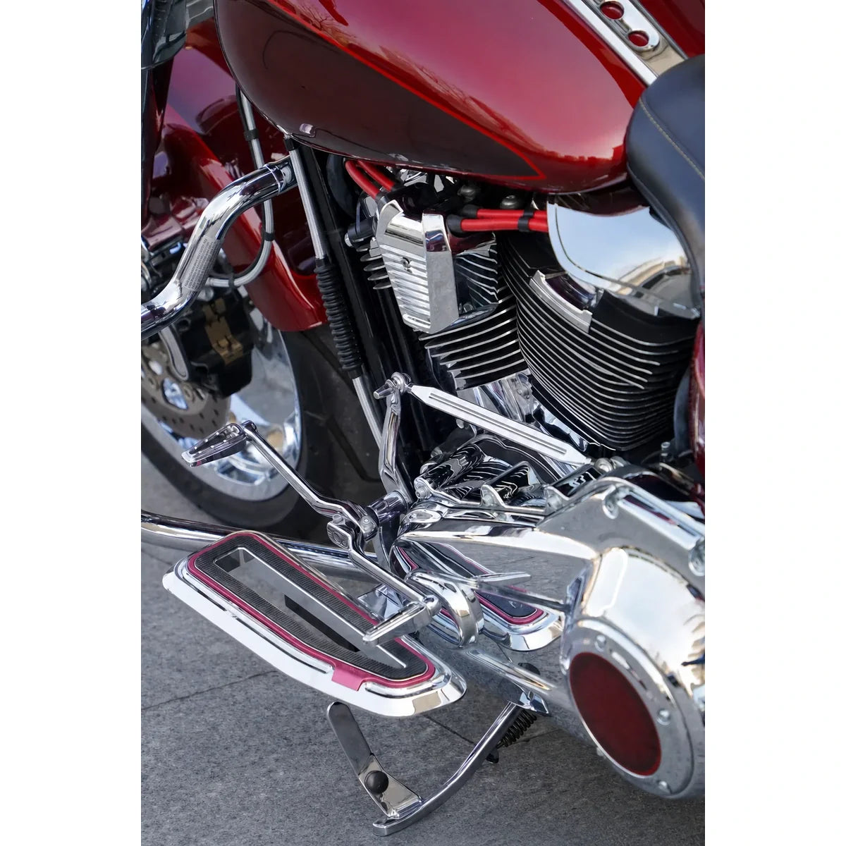 Chrome shift linkage rod installed on a compatible touring motorcycle side view