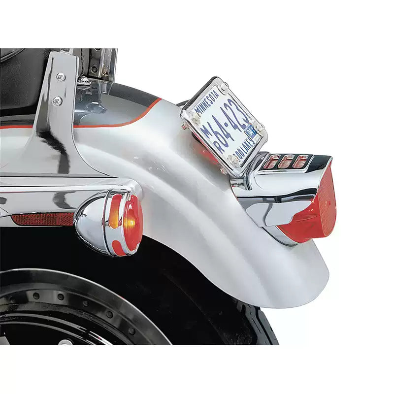 Full-coverage chrome tail light cover installed on a Harley-Davidson motorcycle