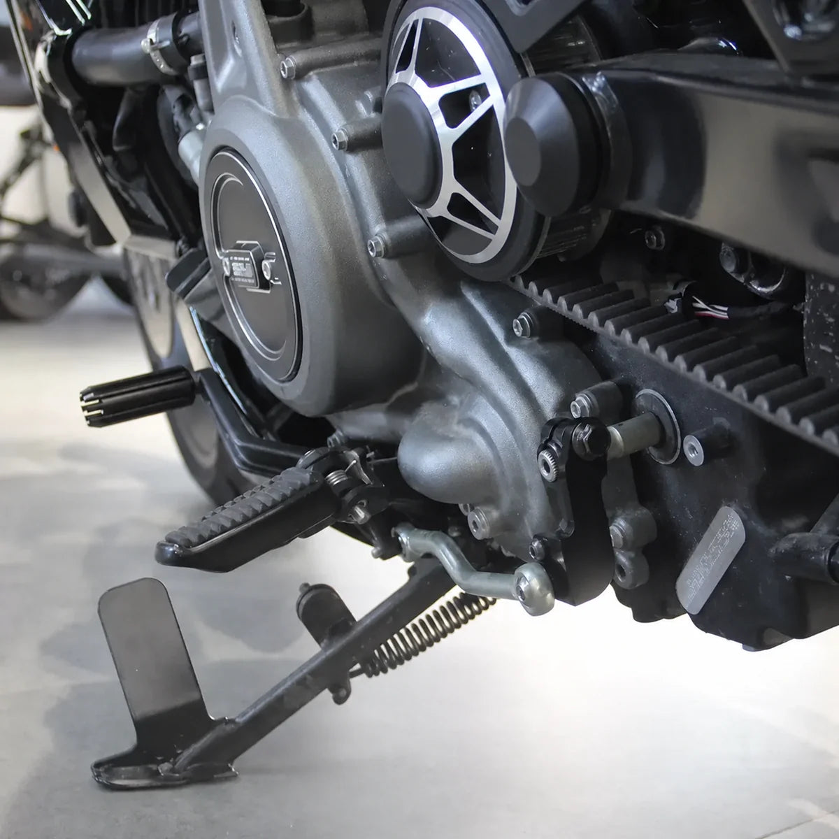 Black shift assist bracket installed on a Harley Nightster RH975 full side view