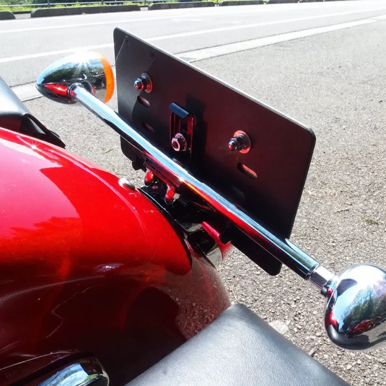 Rear view of Harley turn signal relocation bracket and mounting hardware