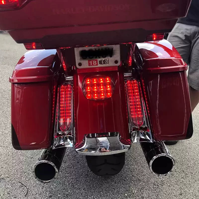 Red Harley Touring motorcycle with vertical filler panel LED lights installed