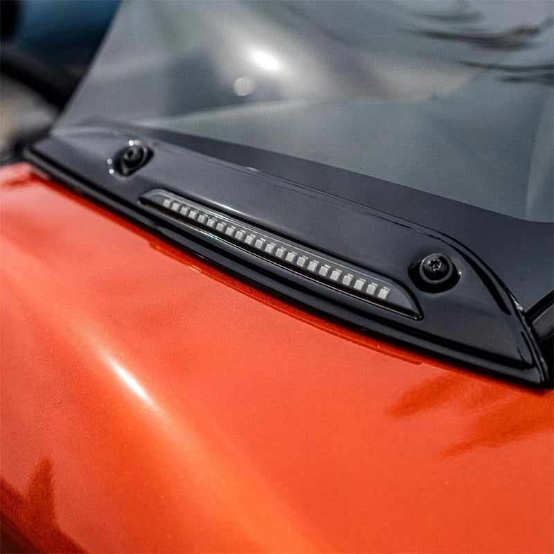 Close-up of Harley Road Glide windshield trim LED light and mounting points