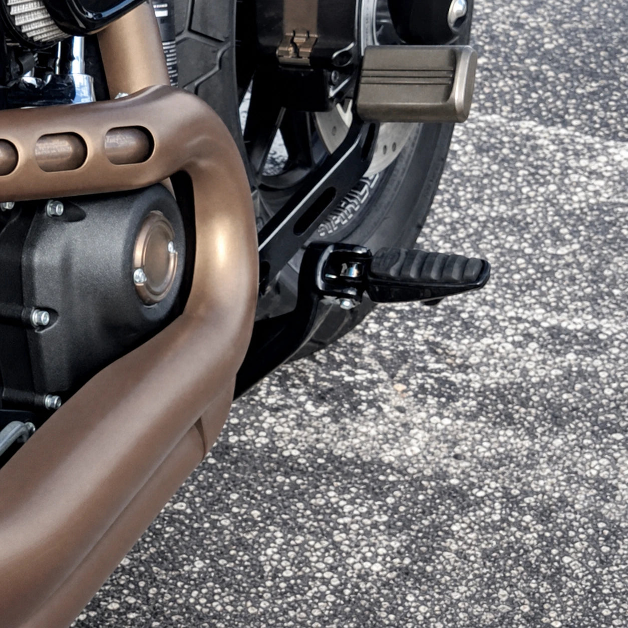 Forward-control brake lever installed on a Harley Softail motorcycle