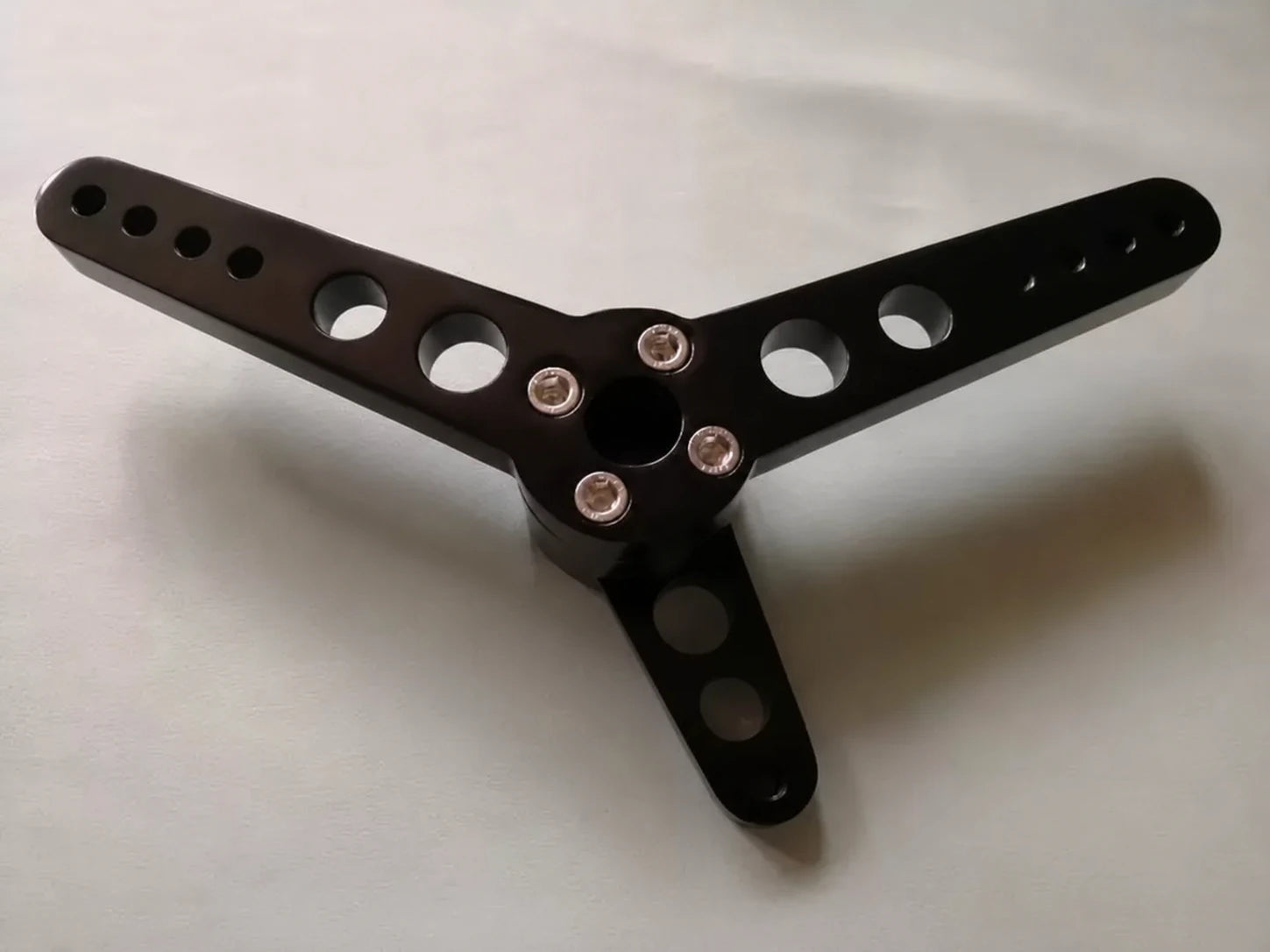 Black TLJT001 forward-control shift lever bracket for Harley Sportster