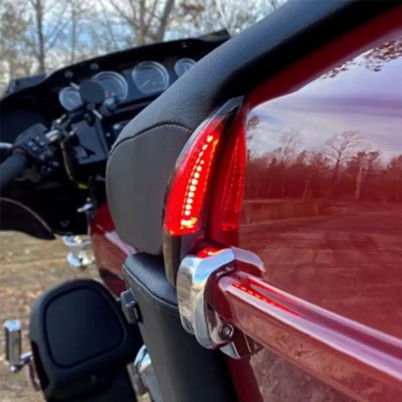 Red LED Tour-Pak side light illuminated on a Harley Touring motorcycle