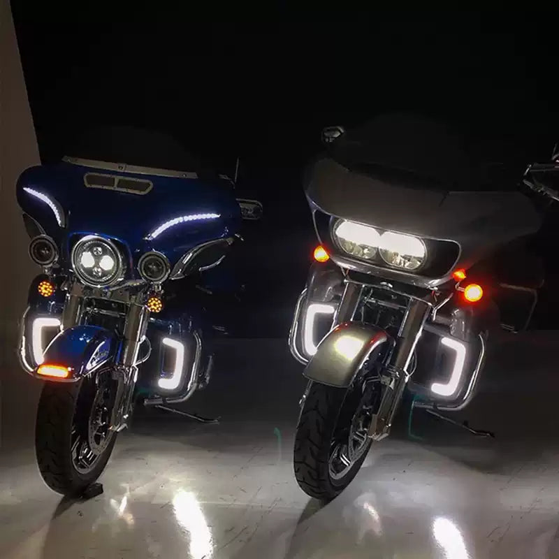 Engine guard LED lights installed on two Harley Touring motorcycles
