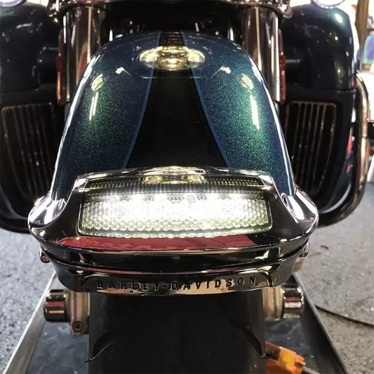 Chrome front fender LED accent light installed on a Harley Touring motorcycle front fender
