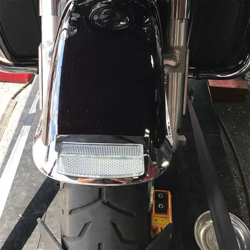 Top view of chrome front fender LED accent light installed on Harley Touring