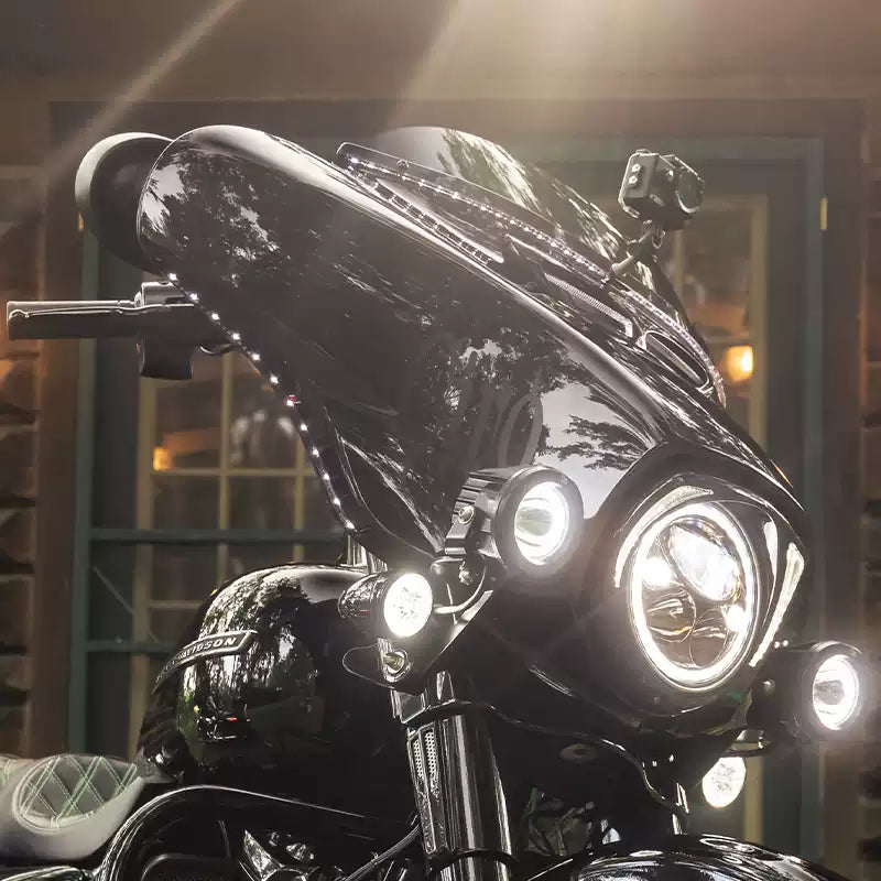 LED eyebrow light strips installed along a Harley Touring front fairing