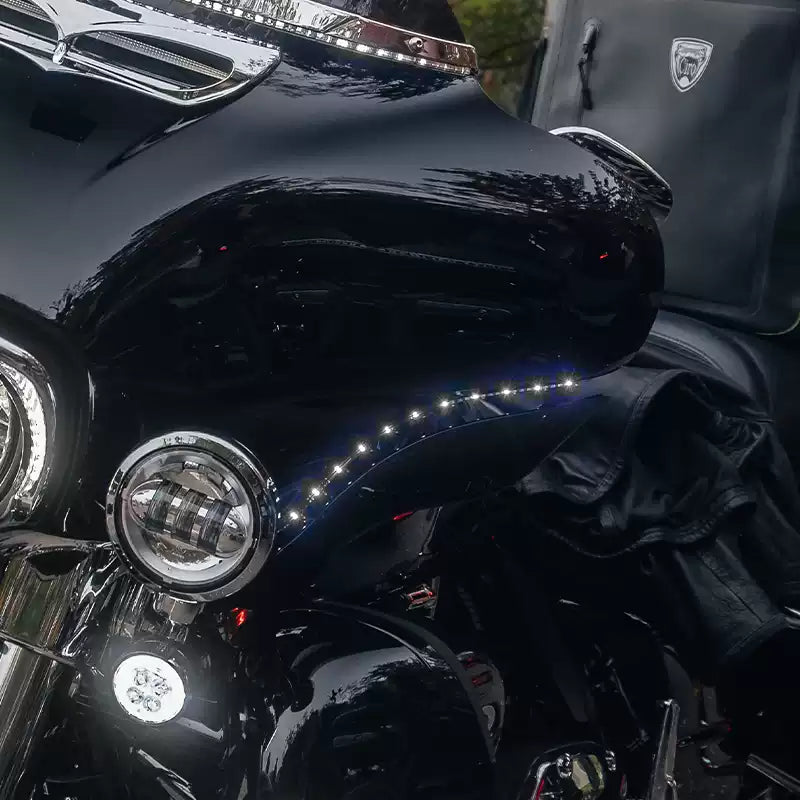 White LED fairing eyebrow running light illuminated on a Harley Touring motorcycle