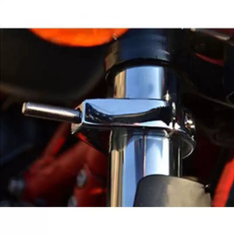 Front view of chrome turn signal relocation bracket mounted to a Harley fork