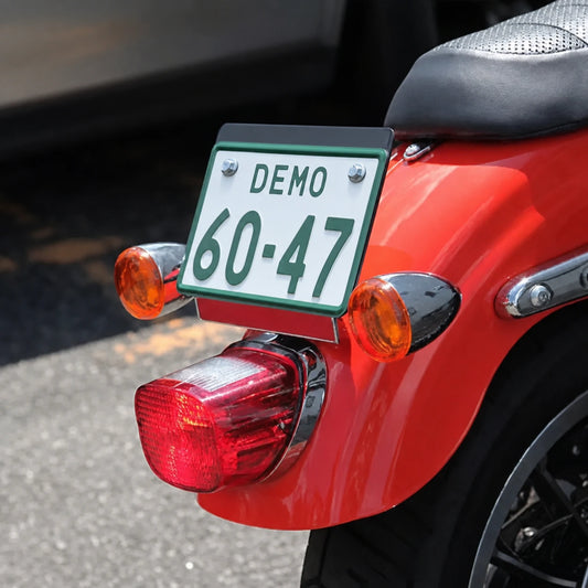 Harley rear turn signal and license plate relocation bracket installed