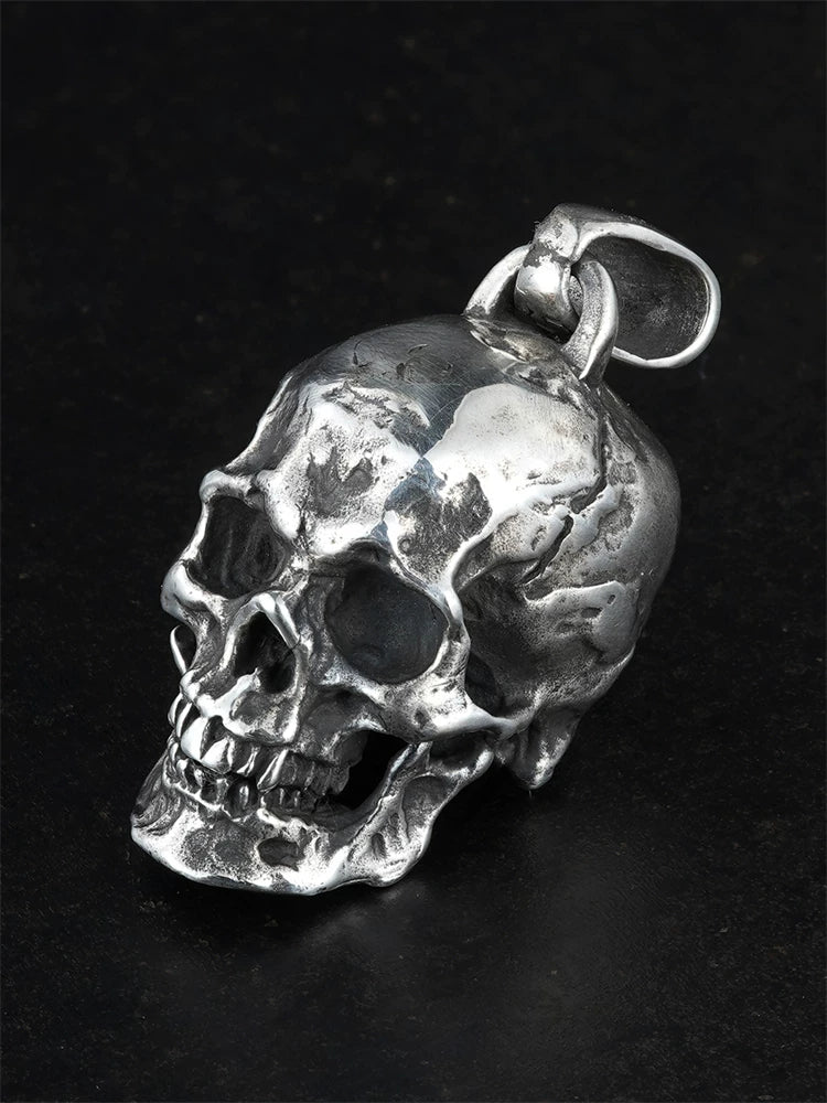 Heavy anatomical skull sterling silver biker pendant, angled view