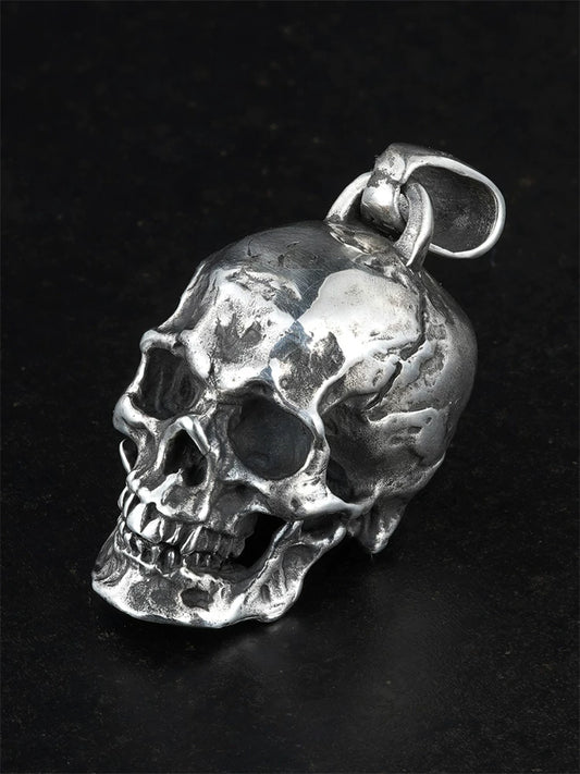 Heavy anatomical skull sterling silver biker pendant, angled view