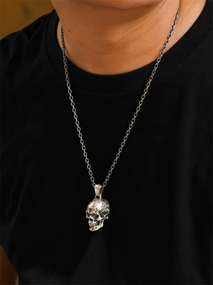 Heavy anatomical skull sterling silver biker pendant worn on chain