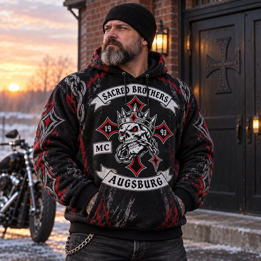 Broad rider wearing a heavyweight custom biker fleece hoodie outside a clubhouse on a cold morning.