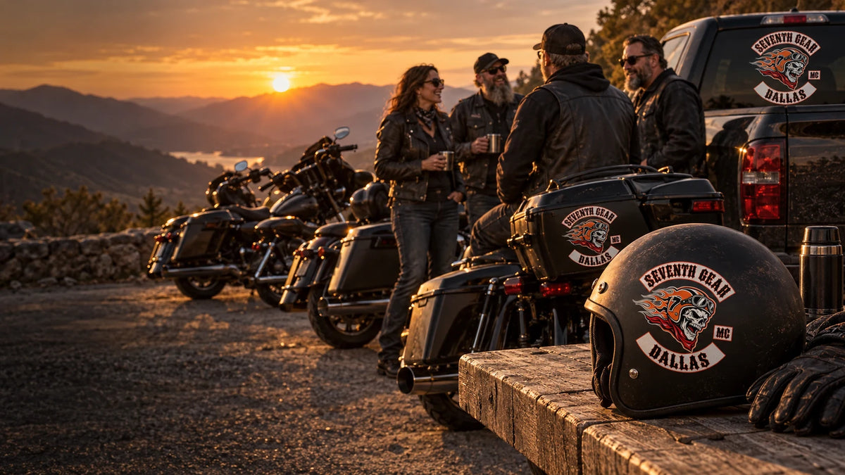 Harley-style V-twin club riders displaying coordinated custom club stickers on a helmet, motorcycle case and support truck at a mountain turnout.