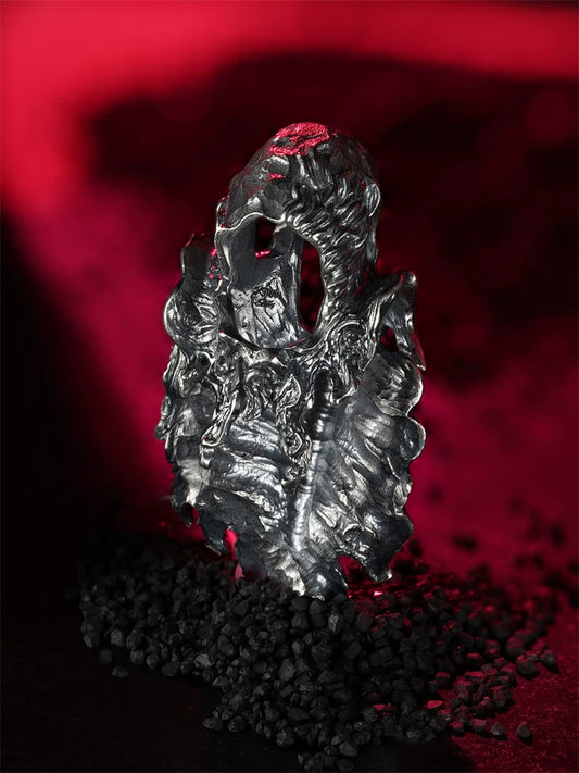 Hollow cloak sterling silver gothic biker pendant on red background