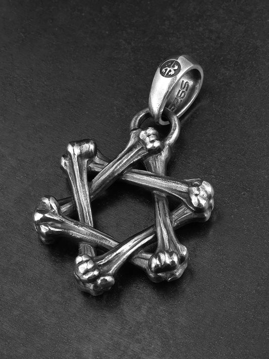Angled view of crossed bone hexagram silver pendant