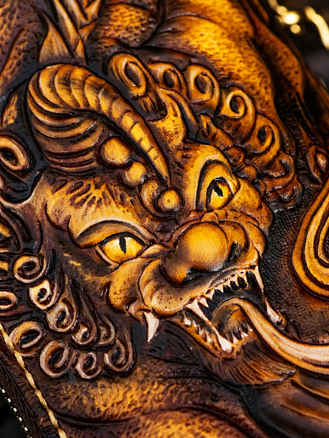 dimensional Pixiu carving on a full-grain leather biker wallet