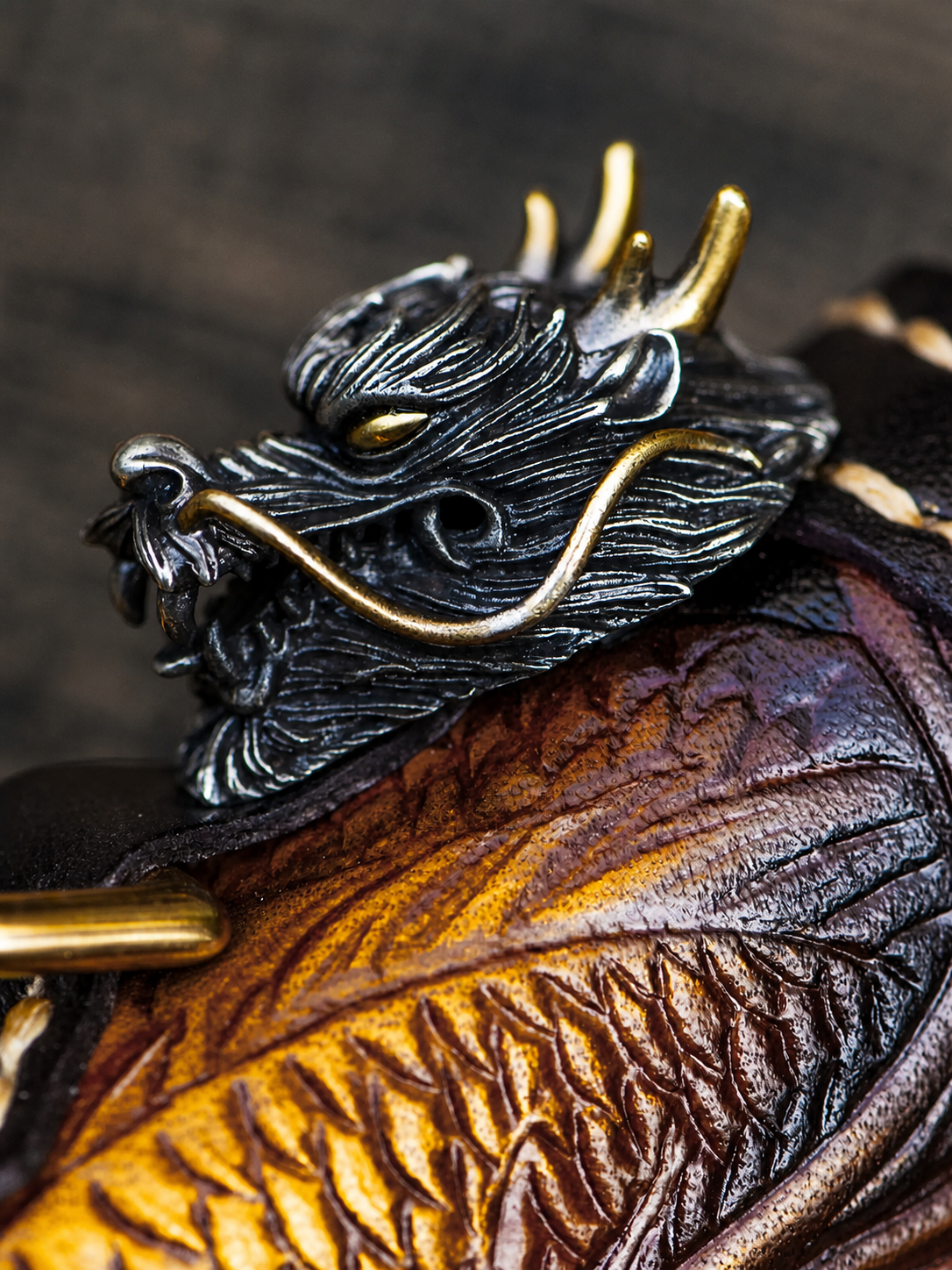 sculpted dragon-head metal hardware on a biker wallet