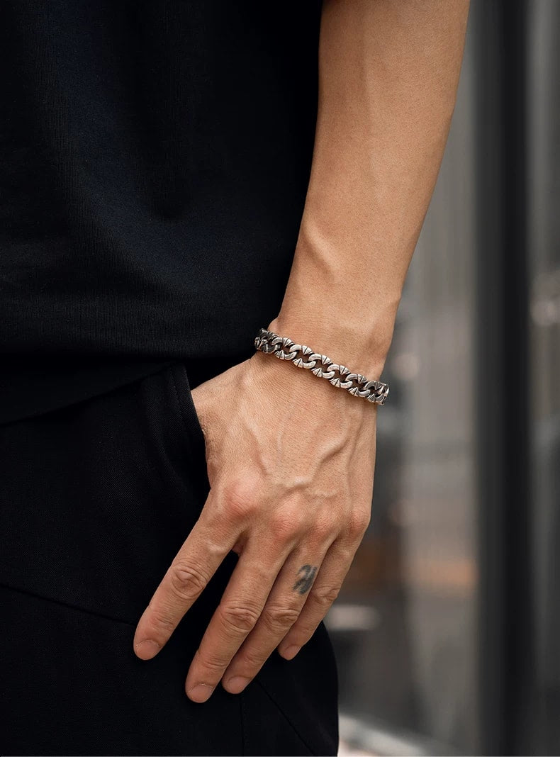 Irregular Interlocking Sterling Silver Biker Bracelet – wrist and design view 1