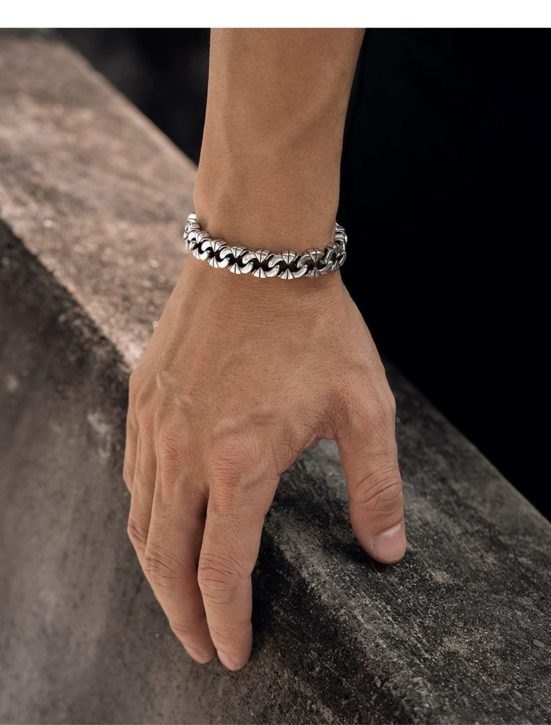 Irregular Interlocking Sterling Silver Biker Bracelet – wrist and design view 4