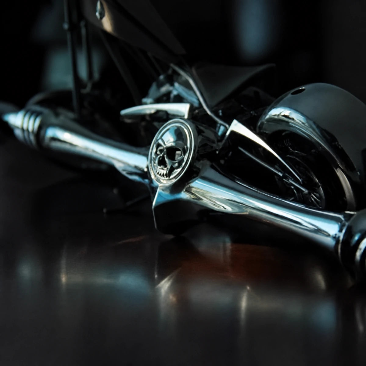 Close-up of the Kuryakyn 1075 chrome skull shift linkage mounted on a motorcycle