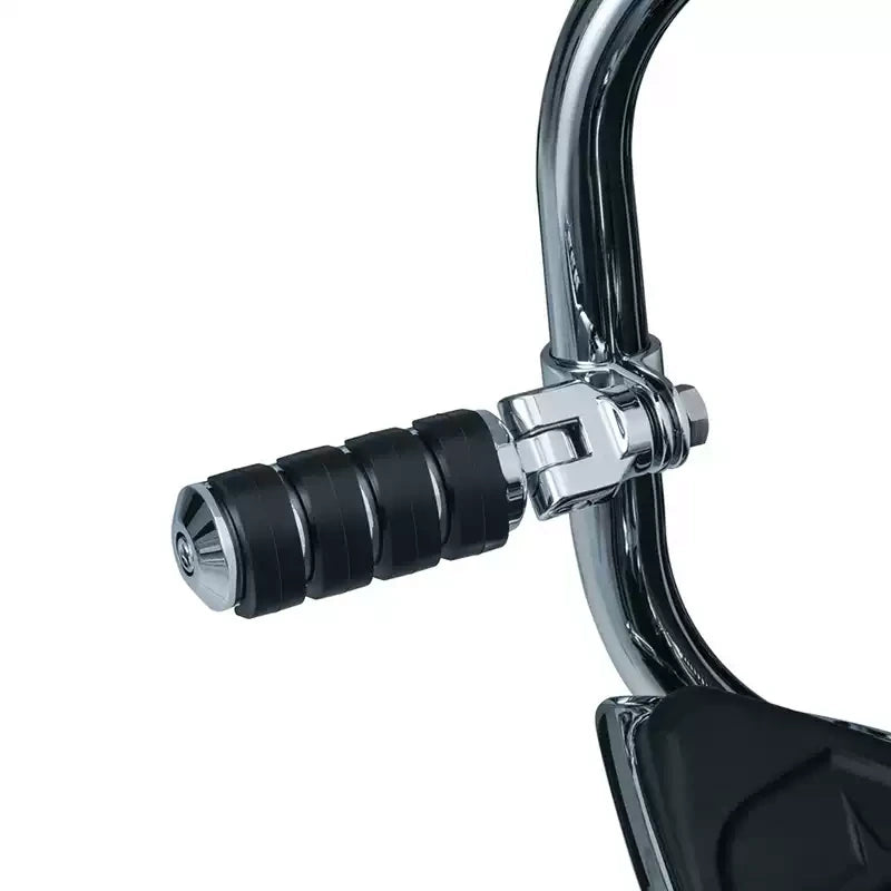 Round Kuryakyn highway peg mounted on a chrome motorcycle engine guard