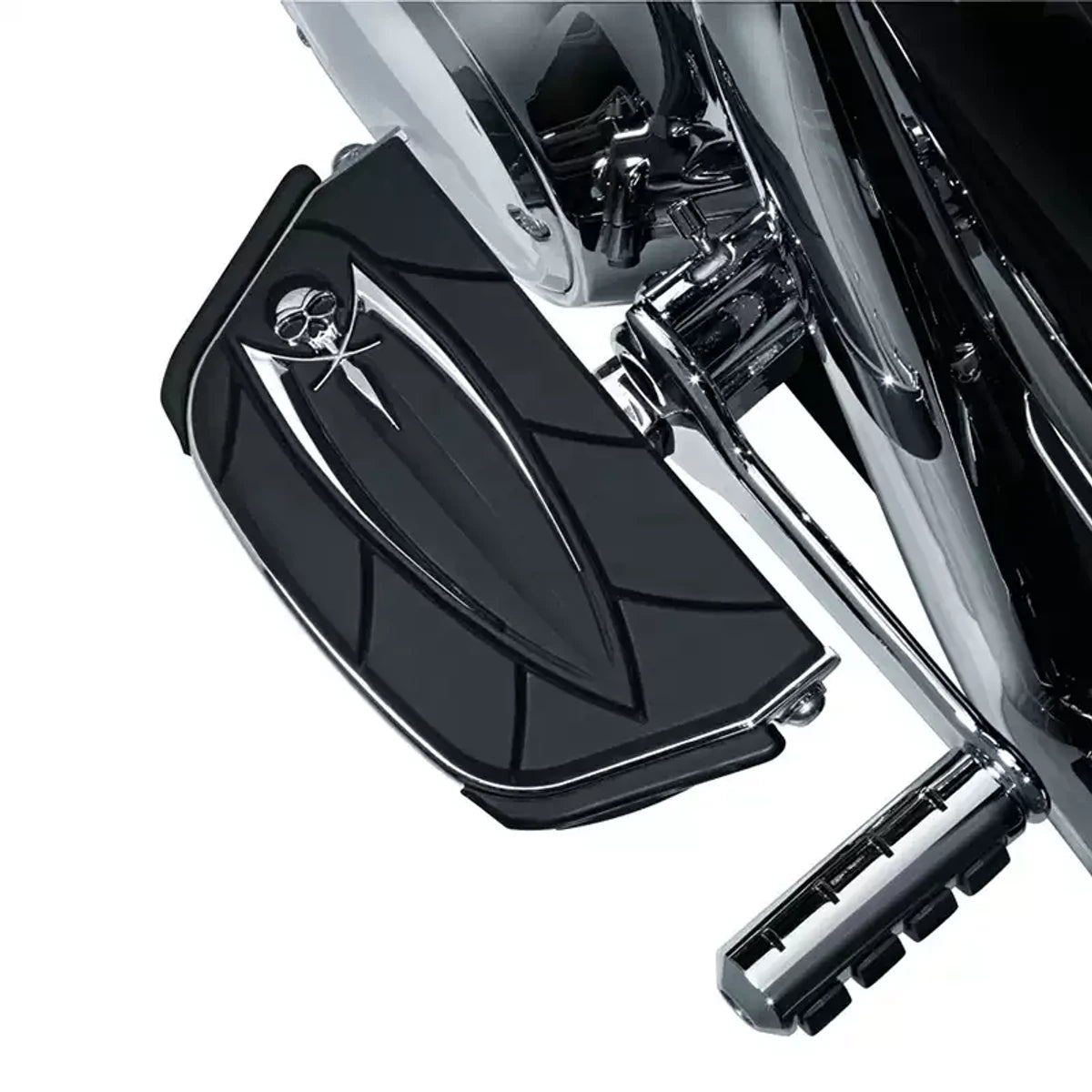 Kuryakyn skull footboard installed on a compatible Harley motorcycle