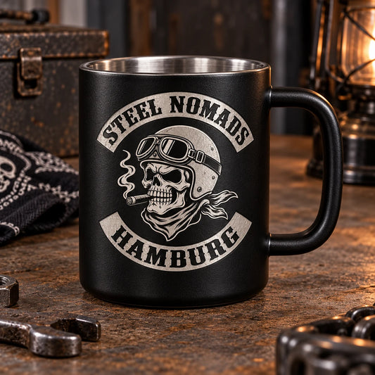 Complete black powder-coated stainless mug in a safe enclosed laser station, club emblem revealed as bright metal engraving, no operators.
