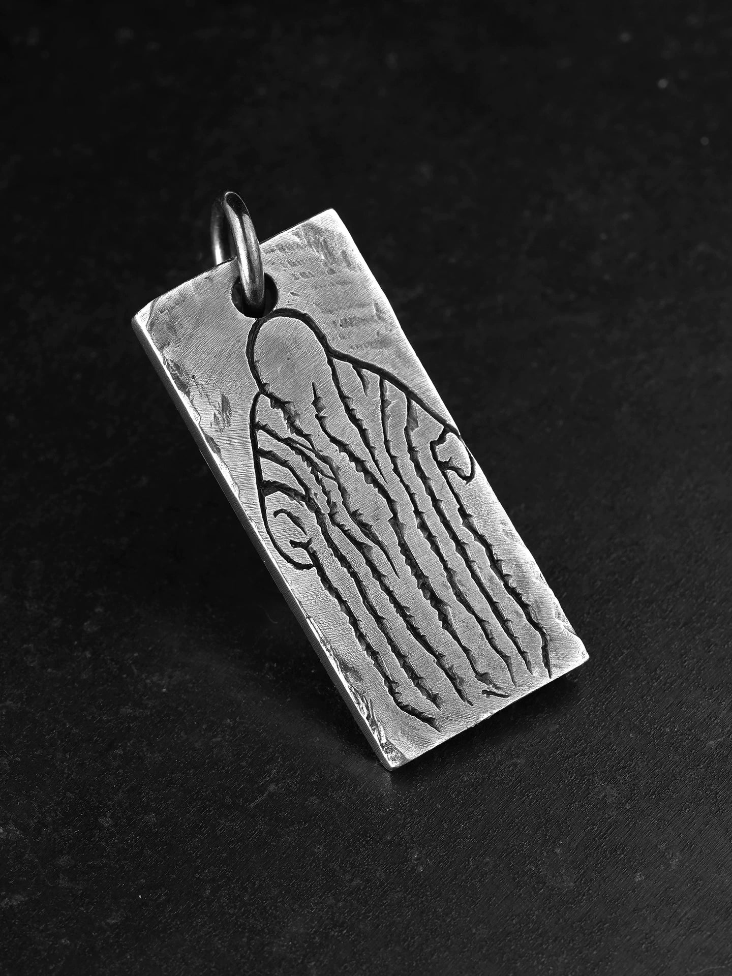 Back view of engraved sterling silver motorcycle pendant